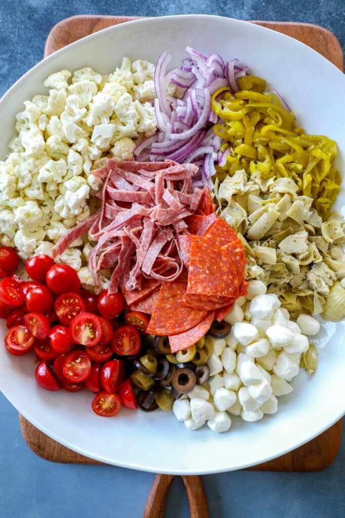 Cauliflower Antipasto Salad ingredients in a large bowl 
