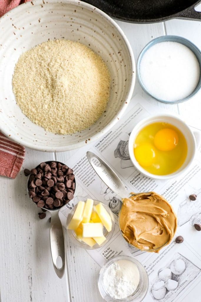 Keto Skillet Peanut Butter Chocolate Chip Cookie ingredients on a white table.