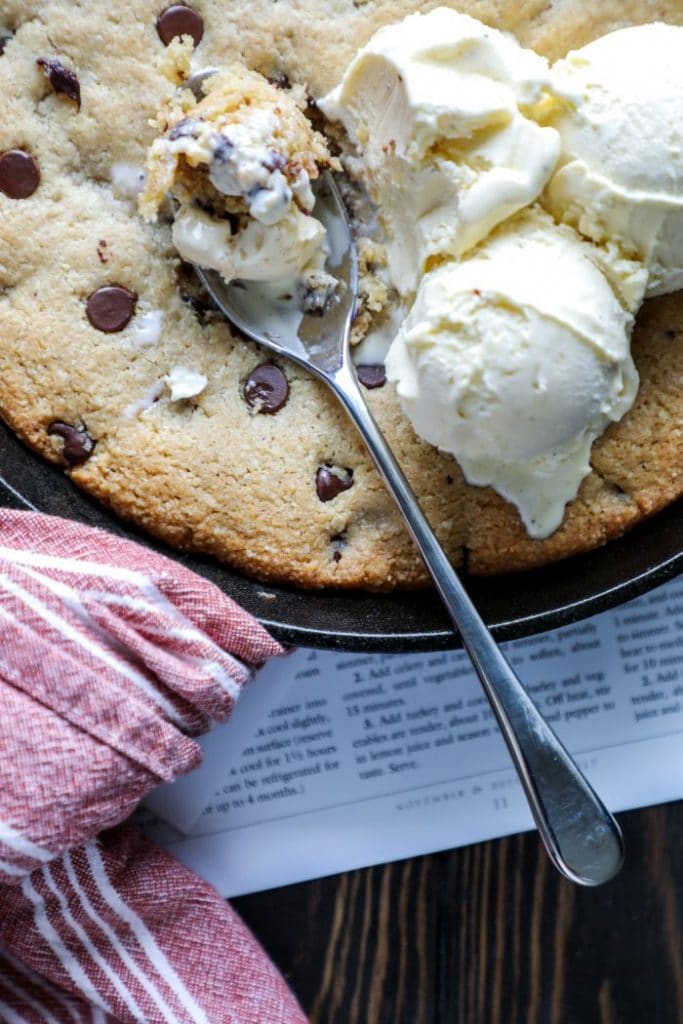 Spoon scooping out the keto peanut butter cookie with some ice cream.