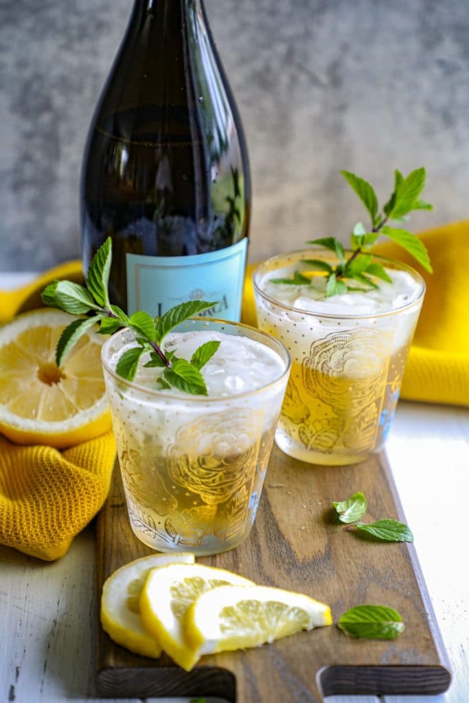 two glasses of prosecco mint juleps 