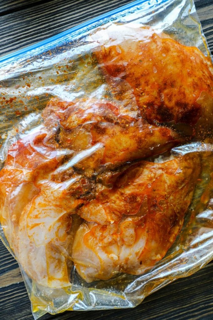 Southwest chicken marinating in a plastic bag