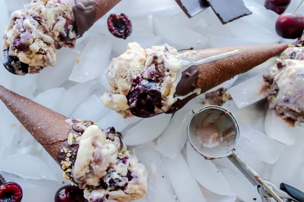 A keto ice cream cone with low carb cherry garcia ice cream in it.