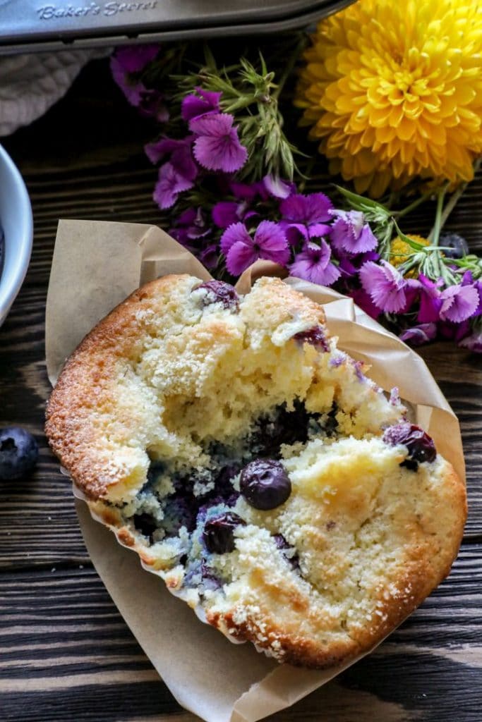 A keto almond flour blueberry muffin cut in half. 