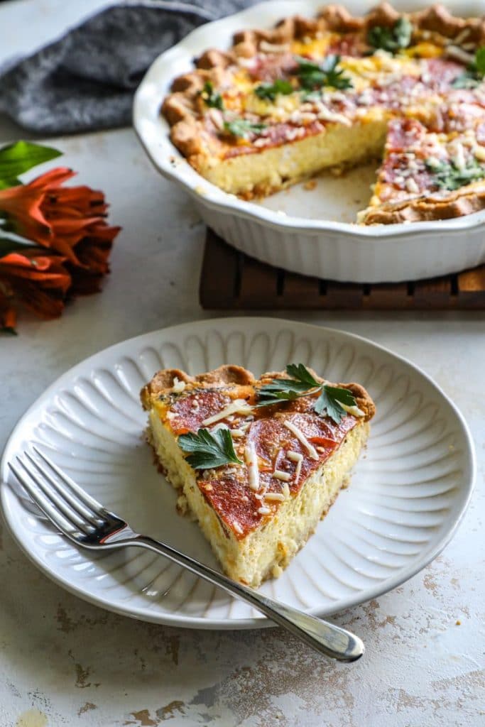 Keto Pepperoni Pizza Quiche slice on a plate