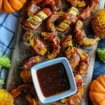 Low Carb BBQ Bacon Wrapped Delicata Squash on a cutting board