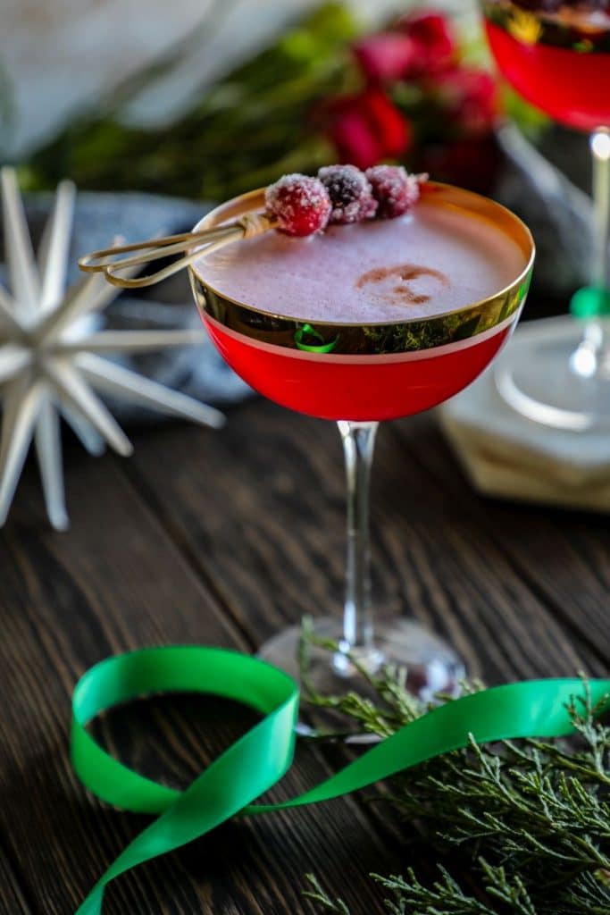 Cranberry Pisco Sour with sugared cranberry garnish