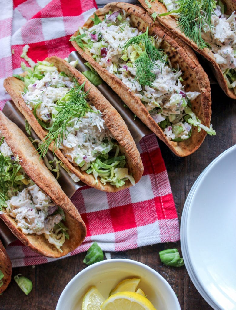 A plate of food on a table, with Taco and Salad