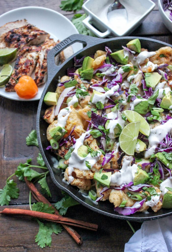 A bowl of Jerk chicken nachos on pork rinds. 