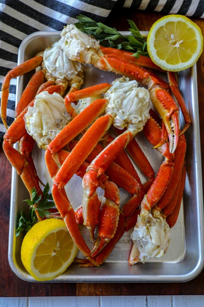 Fresh snow crab legs on a silver tray