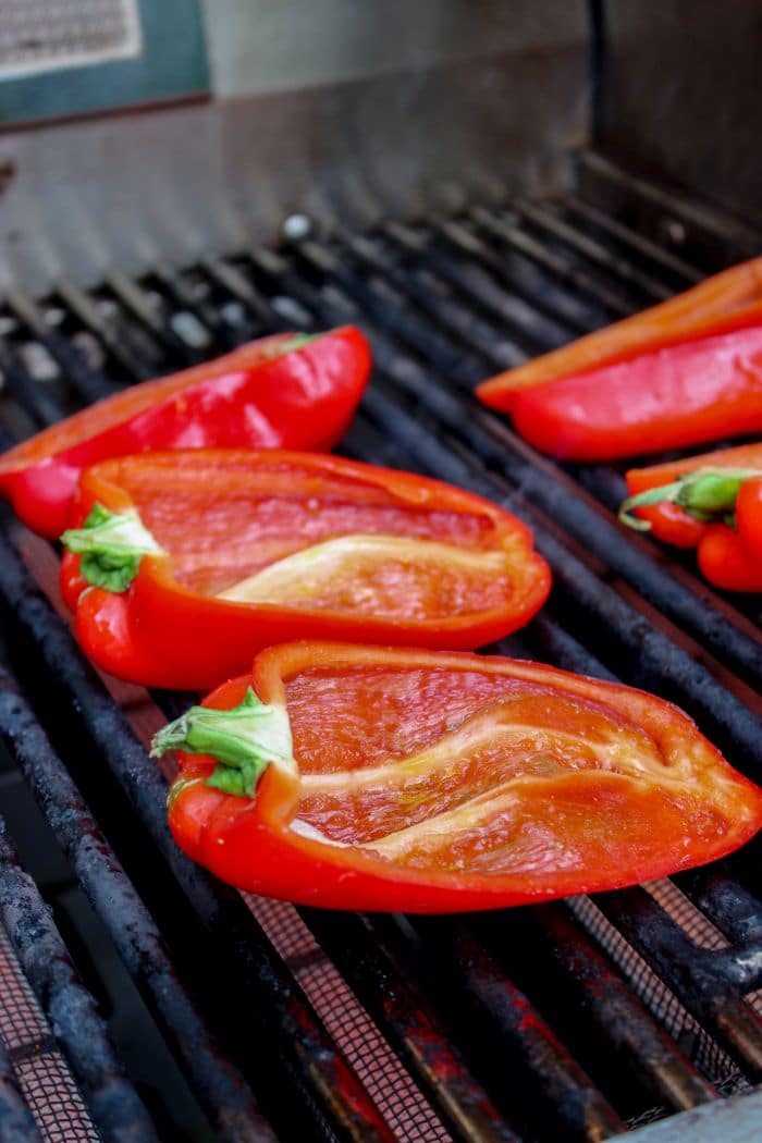 Cooking the red peppers on the grill.