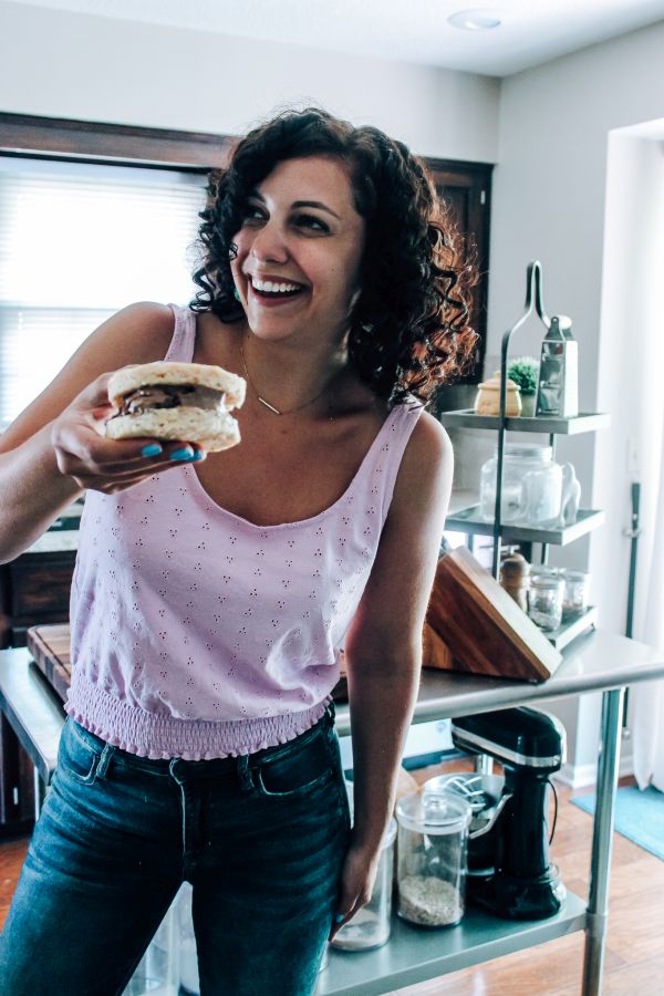 A woman standing in front of a window, with Keto Ice Cream