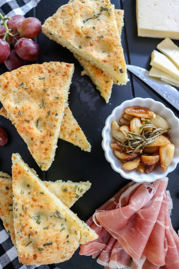 Focaccia bread pieces on charcuterie board.