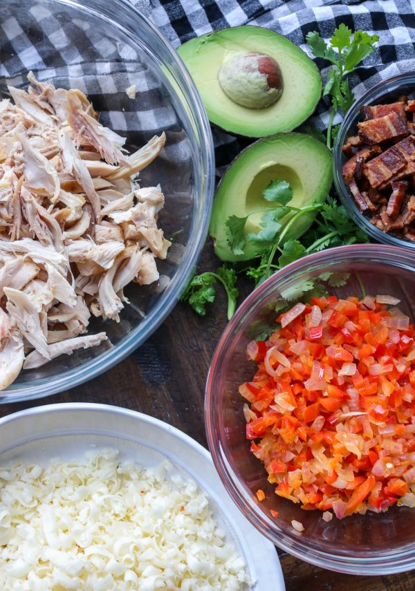 shredded chicken, cheese, bacon, peppers, and avocado 