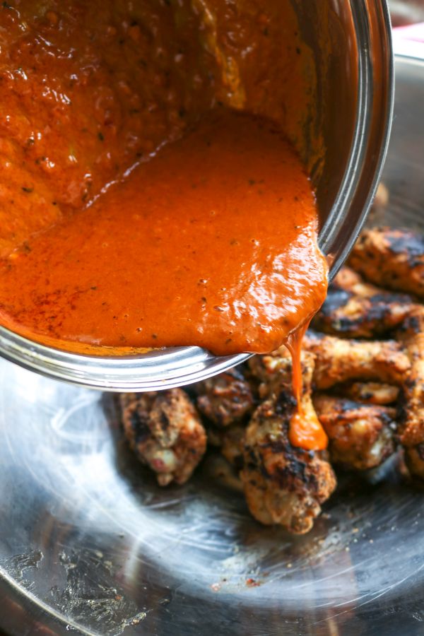 thai curry hot sauce poured over chicken wings 