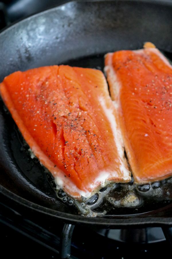 Cast iron pan searing salmon skin