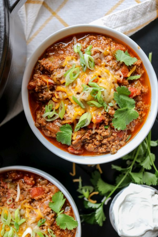 Hand holding low carb beef chili