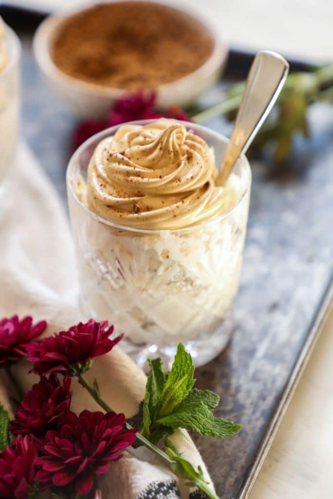 A cup of dalgona affogato with a spoon.