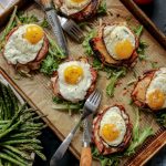 Six open faced keto croque madame on a tray.