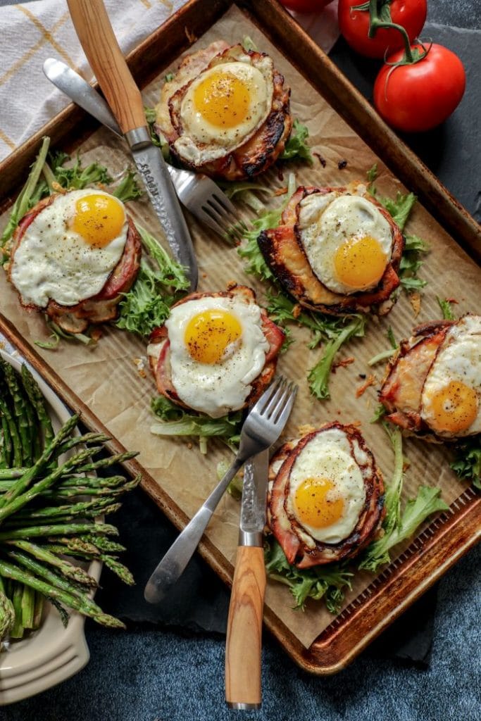 Six open faced keto croque madame on a tray.