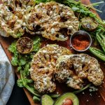 A platter of elote cauliflower steaks.