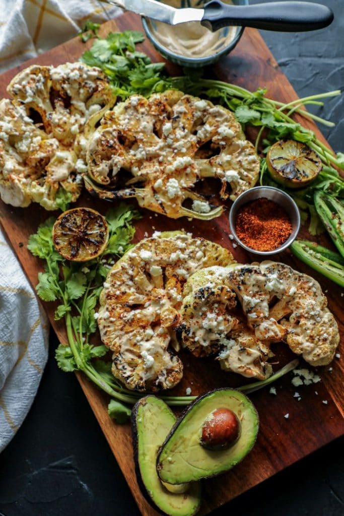 A platter of elote cauliflower steaks.