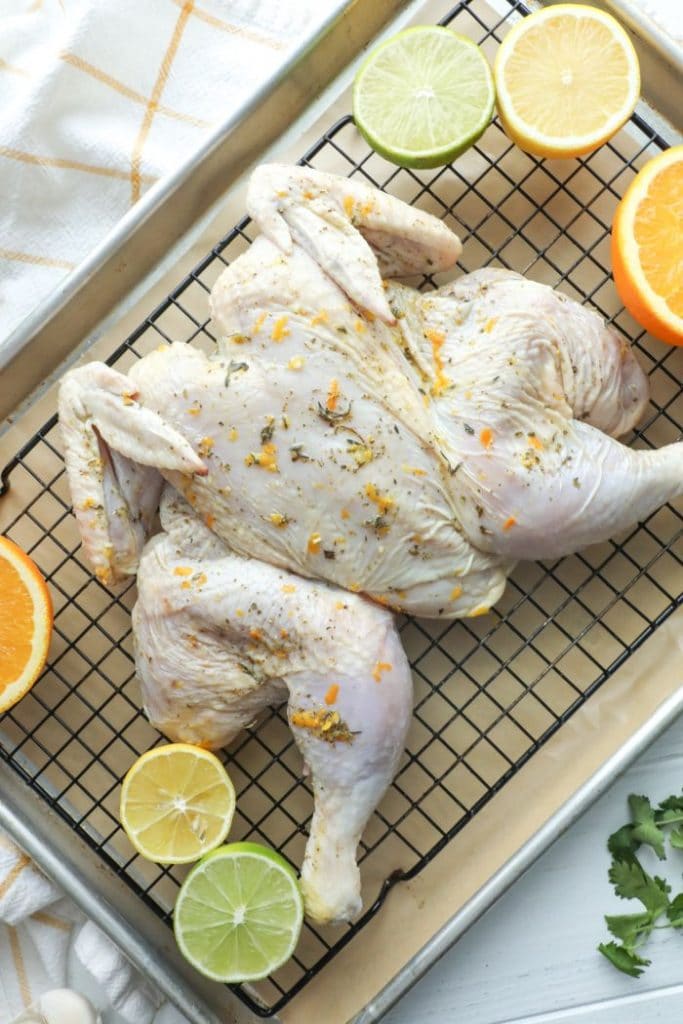 Mojo chicken on a baking sheet ready to be cooked. 