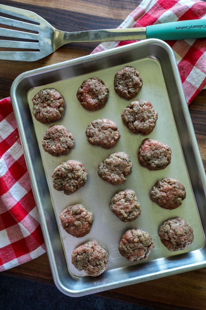 Raw mini burger patties for the kebabs.