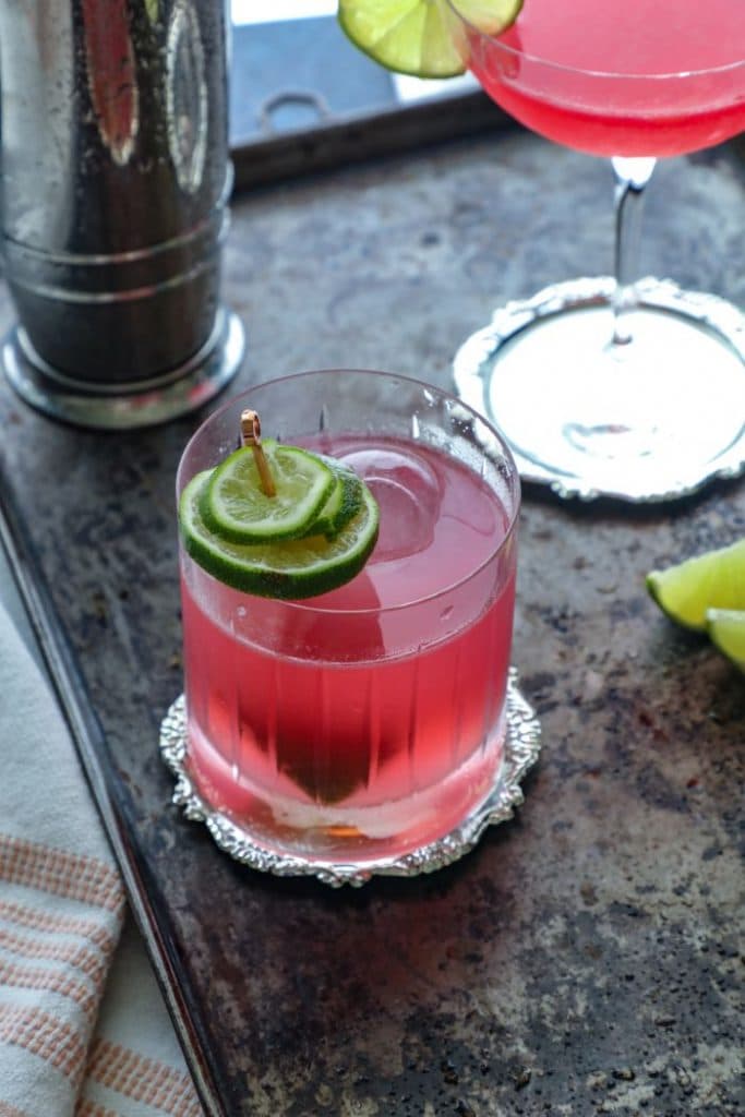 Close up of the mezcal cosmopolitan cocktail in a rocks glass. 