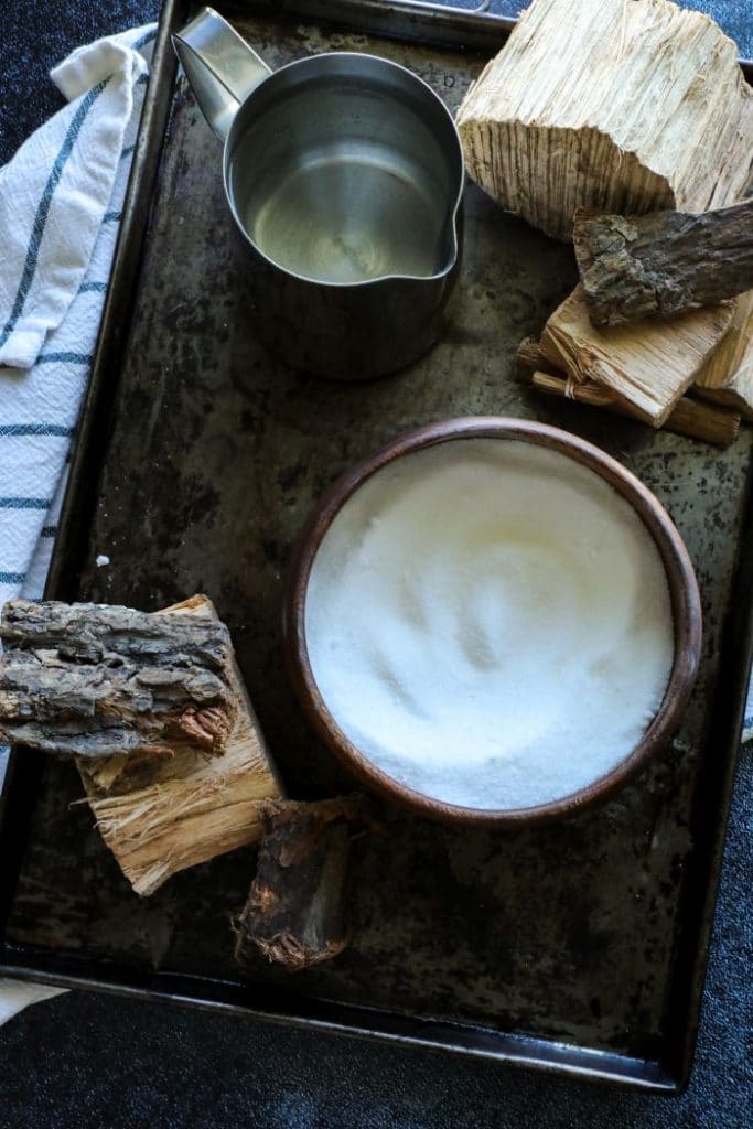 A tray with water and sugar on it.