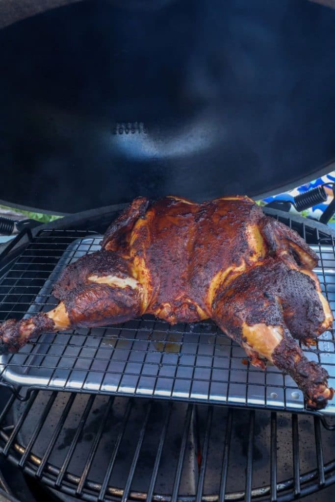 Grilled Spatchcock Chicken Tinga on the grill.