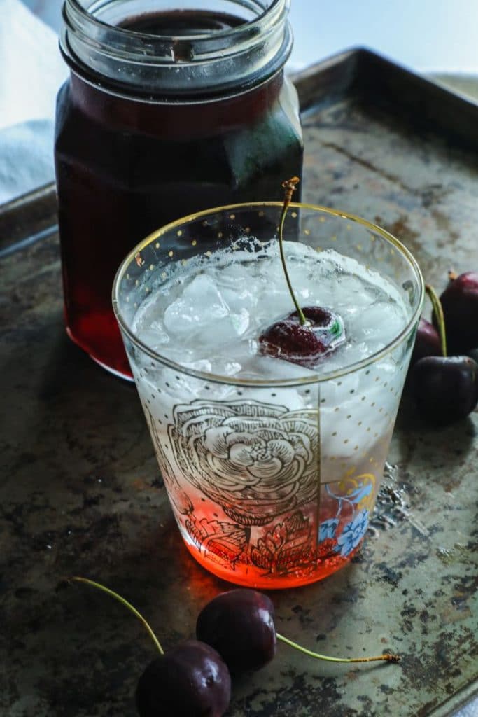 A keto shirley temple made with A tablespoon of Keto Grenadine Cocktail Syrup.