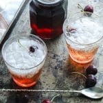 Keto Grenadine Cocktail Syrup with two shirley temples on a tray.