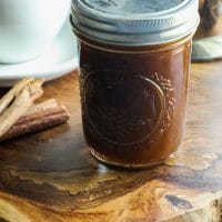 A jar filled with Keto Pumpkin Spice Simple Syrup