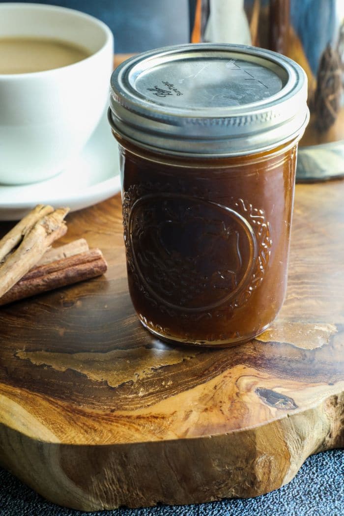 A jar filled with Keto Pumpkin Spice Simple Syrup