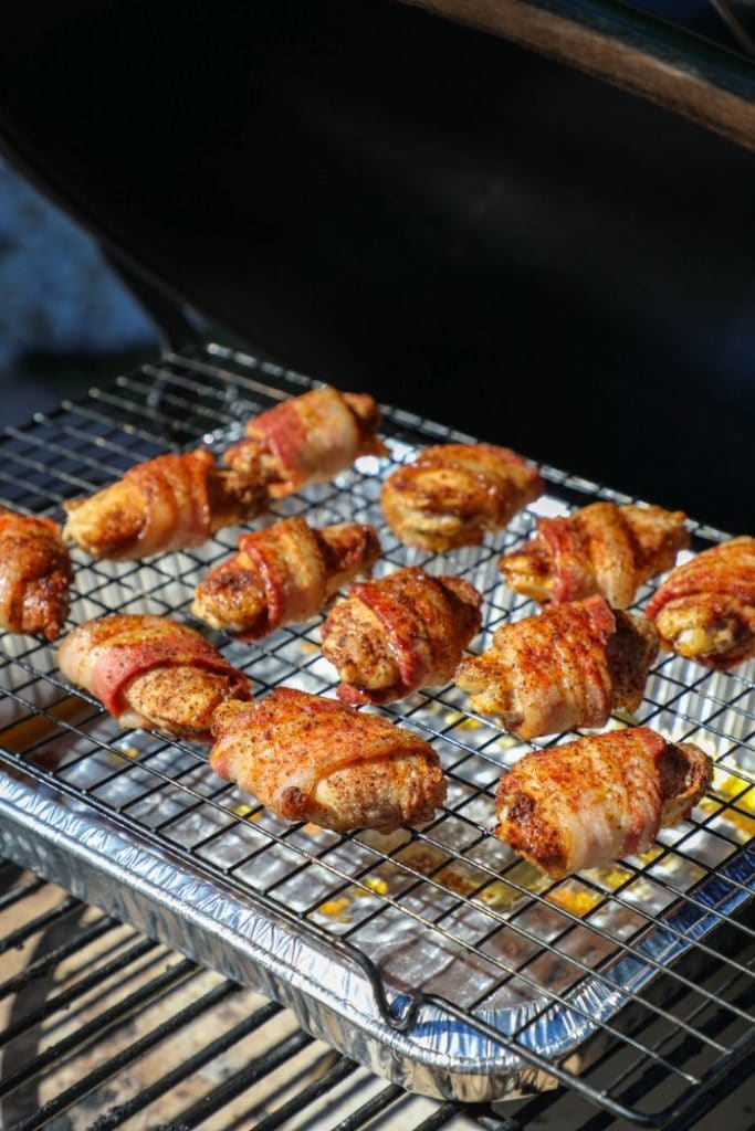 Bacon Wrapped Chicken Wings with Beer Cheese Sauce on the big green egg