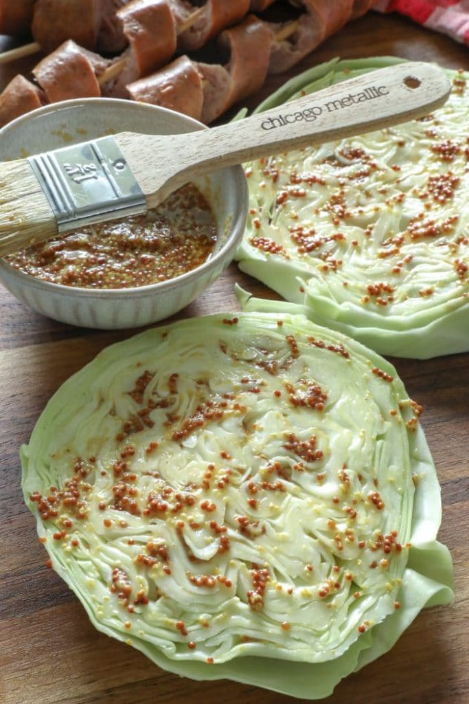 Mustard marinade over the cabbage steaks.