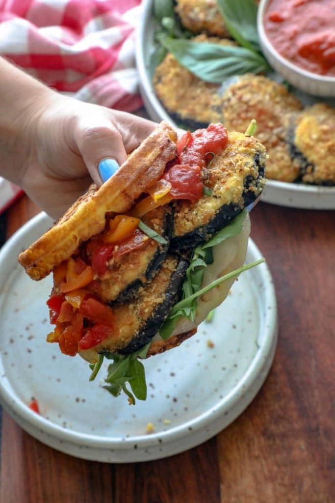 Keto eggplant parmesan sandwich on a chaffle bun