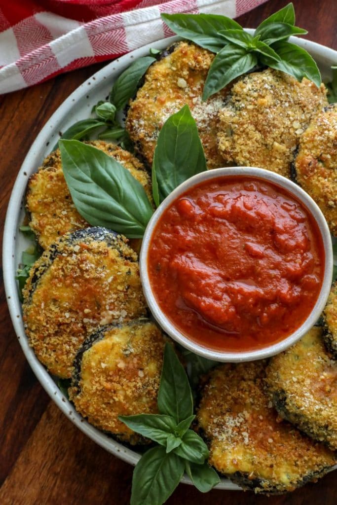 A plate of Crispy Keto Ricotta Stuffed Eggplant Rounds