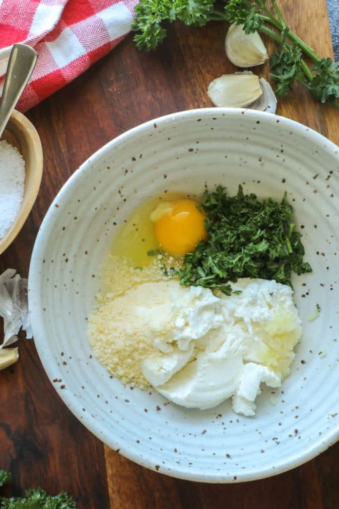 Crispy Keto Ricotta Stuffed Eggplant Rounds filling ingredients in a bowl.