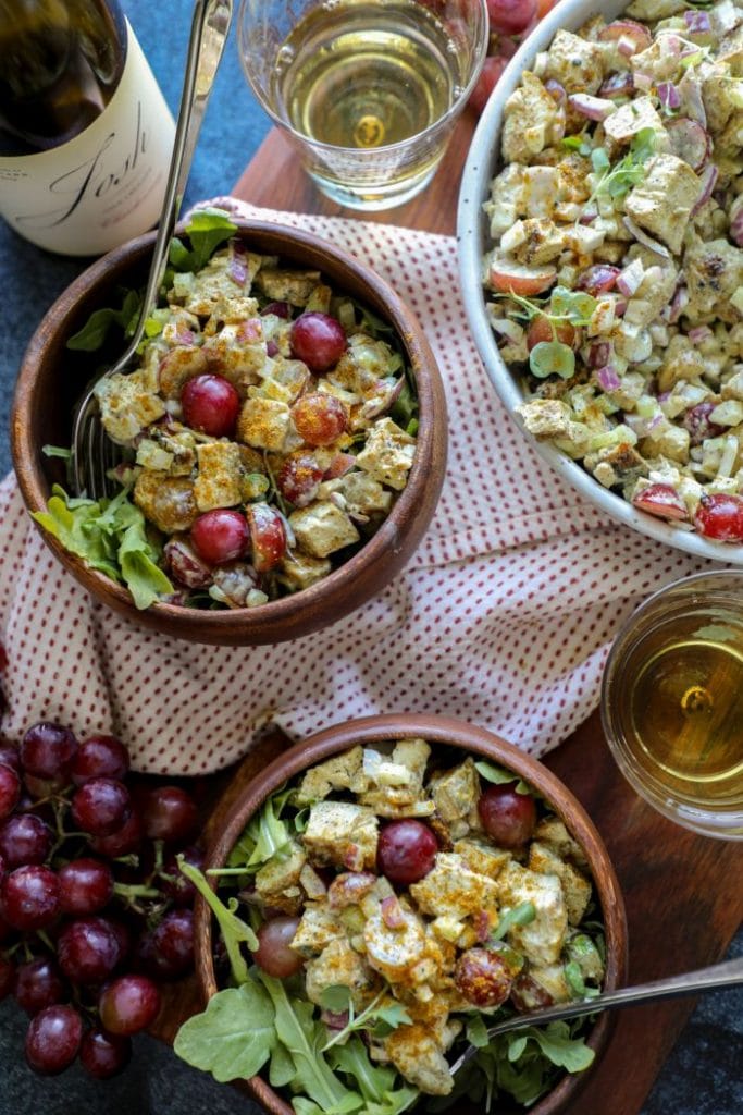 Grilled Curry Chicken Salad (keto whole 30) in two bowls on a brown cutting board.