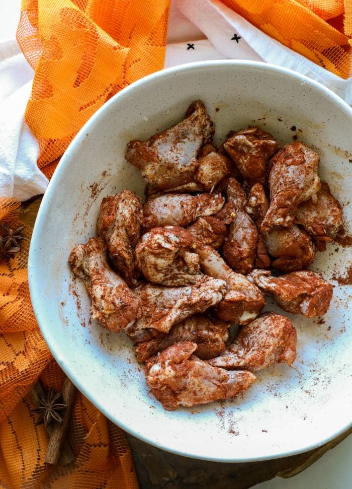 Grilled Pumpkin Spice Chicken Wings in a bowl with the rub on them.
