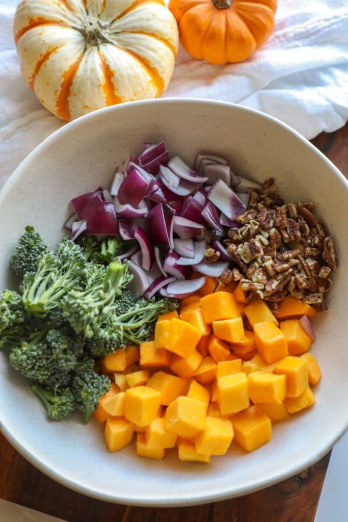 Seasonal vegetables, chopped up in a white bowl.