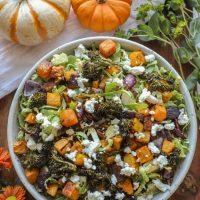 Shredded Brussel Sprouts and Roasted Vegetable Salad in a large white bowl