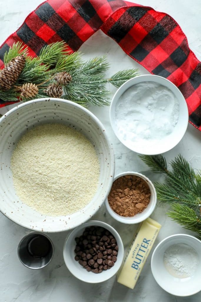 Keto hot cocoa cookie ingredients in bowls on a table.