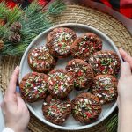 Keto Hot Cocoa Cookies on a plate with a brown placemat underneath.