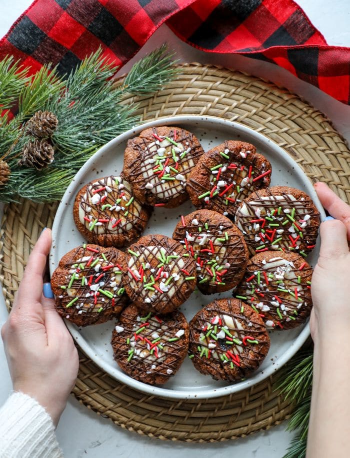 Keto Hot Cocoa Cookies on a plate with a brown placemat underneath.