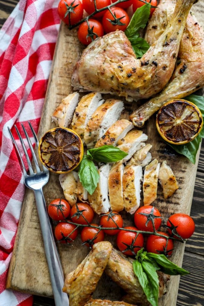 Sliced up spatchcock chicken on a platter