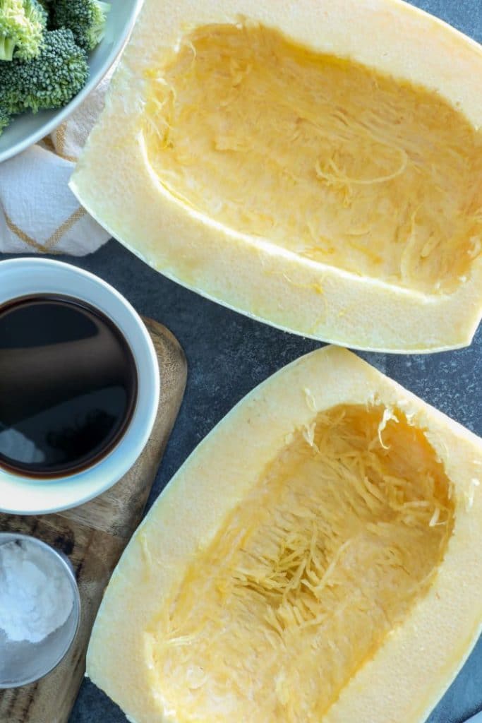 Halved and seeded spaghetti squash for beef and broccoli.