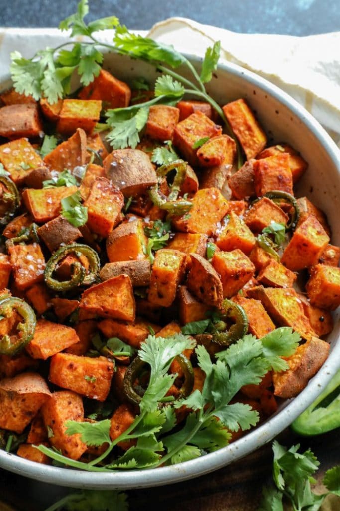 Spicy and Smoky Cumin Roasted Sweet Potatoes in a bowl.
