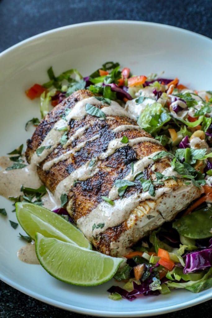 blackened mahi over brussel sprout slaw in a bowl